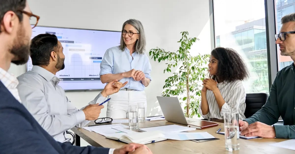 A room full of Executive Assistants discussing in-person meeting budgets