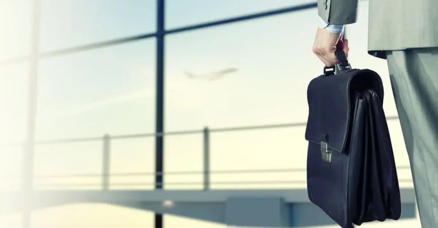 Businessman holding a briefcase in an airport