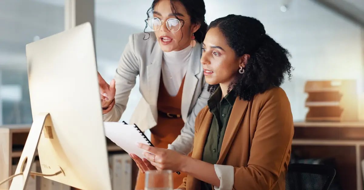 Colleagues discussing AI for productivity in the workplace