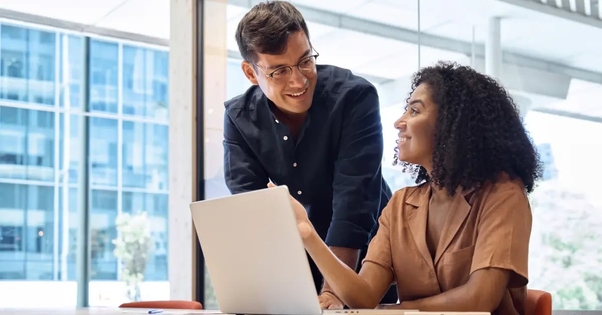 EA sharing year-end planning with her executive in the office