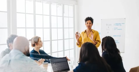 HR manager leading training to empower teams to plan better in-person meetings
