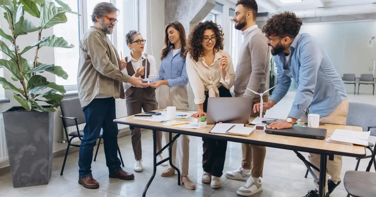 Meeting attendees at the office for a small in-person meeting