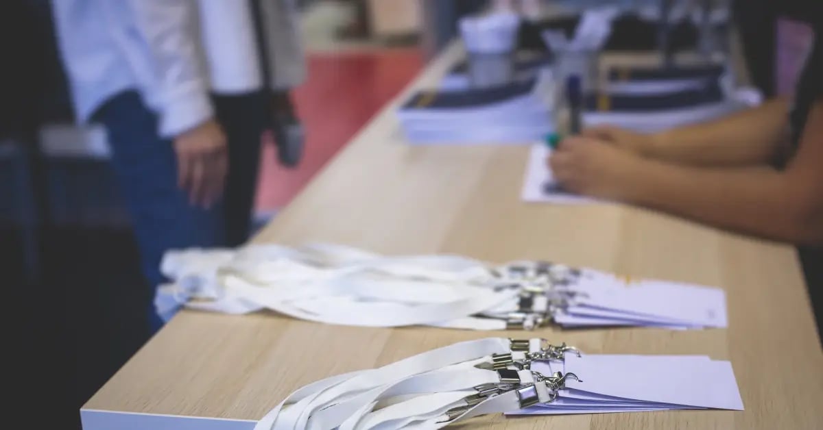Name cards on a table as attendees check-in at an in-person meeting
