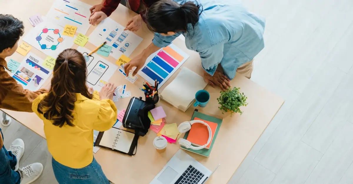 Team in an office working on setting meeting objectives during a brainstorm sessions
