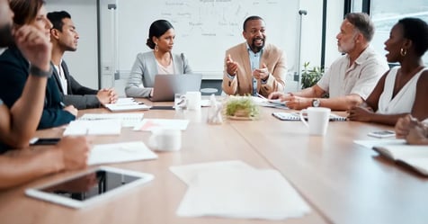 Team talking strategy in a one-day in-person meeting